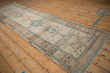 Distressed vintage Karaja rug runner with geometric patterns, palmette main border, and heavy abrashes.
