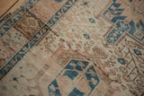 Vintage Karaja runner: distressed texture, abrash, geometric blossoms in pale brown, dusty blue.