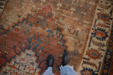 A detailed look at the low, hand-knotted pile and abrashed ground of an antique Bakshaish carpet.