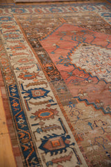 Wide Herati-style border on an antique Bakshaish rug with sapphire blue and terra cotta motifs.