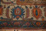 Antique Bakshaish carpet's partial Herati border with blue and terra cotta serrated leaf motifs.