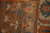 Abrashed coffee-brown field and Herati-style border on a hand-knotted antique Bakshaish carpet.