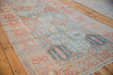 Repeating panel design and distressed texture of a vintage Persian Bakhtiari runner rug.