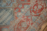 Stylized cartouche border and distressed pile showing wear to the knot heads on a Bakhtiari rug.