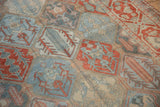 Low-pile texture on a vintage Persian Bakhtiari rug showing its panelled plant and cypress motifs.