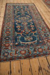 Close-up of Mehriban runner's wide geometric Herati border with floral palmettes and sapphire field.