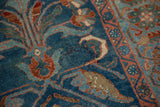 Distressed vintage Mehriban runner showing faded sapphire blue field and cherry red geometric Herati border.