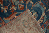 Hand-knotted distressed Mehriban rug, showcasing sapphire blue pile, side cord, and back weave.
