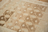 Distressed vintage Hamadan rug pile, showcasing prominent abrash in coffee, sand, and pale blue.