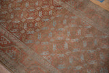 Distressed Belouch runner detail showing geometric guls in pale ruby, coffee brown, powder blue.