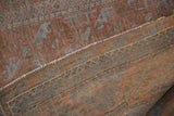 Woven back and intact side cord of a distressed vintage Belouch rug runner.