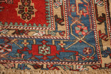 Caucasian-inspired geometric motifs in the layered borders of an antique Persian Karaja rug corner.