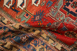 Folded view of an antique Karaja rug showing its short, hand-knotted pile and sharp geometric patterns.