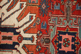 Short wool pile texture and sharp geometric motifs on an antique Karaja Persian rug.