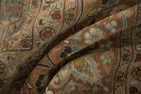 Close-up of distressed Meshed rug pile, revealing faded blossoms and knot head wear.