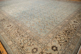 Corner view showing the Herati and turtle samovar motifs on a distressed vintage Tabriz carpet border.