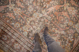 Distressed Mahal carpet texture with sprawling Gul Farang vines in rose, pale blue, and silver tones.