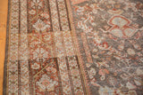 Distressed vintage Mahal carpet: Gul Farang floral pattern, geometric border, and soft patina.