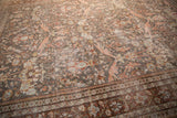 Distressed rose, oxidized silver, and beige Gul Farang pattern with geometric border on a Mahal carpet.