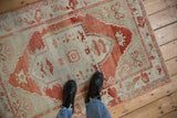 A view showing the soft, worn-to-the-knots texture of a distressed Oushak rug.