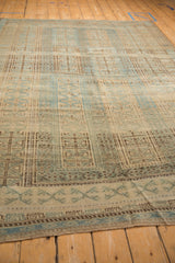 Evenly worn knot heads and heavy abrashes on a distressed Persian Belouch carpet.