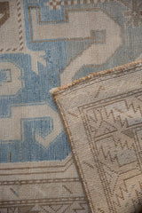 Corner view of a vintage Caucasian runner revealing the low pile and hand-knotted foundation.