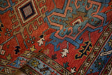 Folded view showing the hand-knotted texture and geometric design of a vintage Karaja rug.