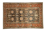 Vintage Mehriban rug with a charcoal lattice pattern, rust geometric border, and pale gold accents.