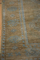 Intact side cord selvage alongside the geometric powder blue border of a vintage rug.