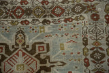 Mostly even wear across the knot heads of a distressed Karaja runner's geometric boteh border.