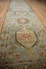 Angled perspective down the vintage Karaja runner, showing the repeating column of contour medallions.
