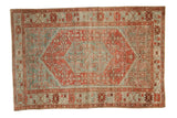 Vintage distressed Malayer rug with a raspberry red hexagonal medallion and a faded powder blue field.