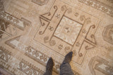 Low-pile texture of a vintage distressed Kars carpet, showing its geometric medallion and ram's horn motifs.