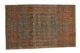 Vintage distressed Malayer rug with an allover Herati design in dusty indigo blue and rust terracotta.