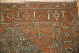 Stylized Herati Samovar border of a vintage Malayer rug showing even wear in rust and dusty blue.