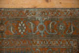 Intact side cord selvage frames the stylized Herati Samovar border in rust and blue.