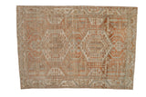 Vintage distressed Malayer rug with an oversized double medallion in pale terracotta and dusty blue.