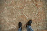 A closer view of the distressed Malayer's texture, showing terracotta and powder blue geometric motifs.