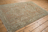Decorative even wear on a vintage Malayer rug with pale terracotta and silver patterns.