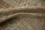 Pliable hand-knotted texture of a vintage Malayer rug with pale terracotta and silver tones.