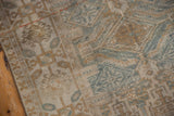 Vintage distressed Belouch runner with even wear, faded blue, terra cotta geometric patterns.