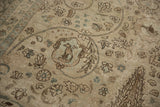 Traditional bird medallion and cypress pattern with distressed texture on a vintage Tabriz rug.