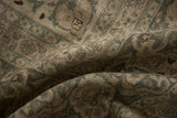 Textured distressed Tabriz carpet pile with faded antique ivory and pale coffee brown tones.