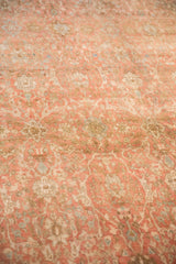 Angled close-up of the distressed, short pile showing samovar panels in pale ruby and sand.