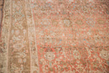 Distressed low pile texture of a vintage Bijar in blush and slate blue tones.