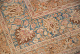 Faded raspberry, sky blue, ivory floral field and palmette border of Meshed carpet.