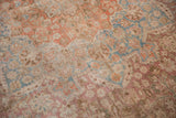 Distressed vintage Meshed carpet pile with mostly even wear and faded raspberry, sky blue.
