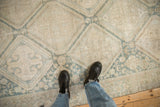 Distressed vintage Hamadan runner's faded teal diamond lattice and ivory field.