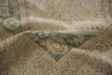 Distressed pile with mostly even wear, faded dusty blue diamond panels on vintage Hamadan.
