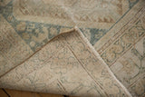 Hand-knotted foundation and sturdy weave of the vintage Hamadan rug, showing fringe and selvage.